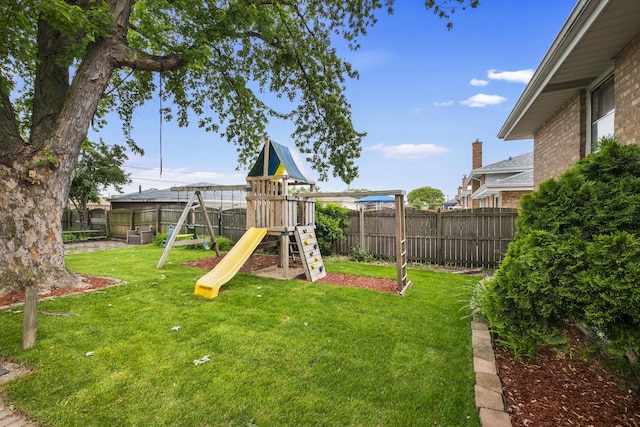 7707 S Oketo Ave, Bridgeview, IL 60455 - fenced backyard featuring a playground