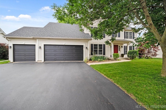 529 Hammer Ln, North Aurora, IL 60542 - colonial inspired home with driveway, an attached garage, a front yard, and roof with shingles