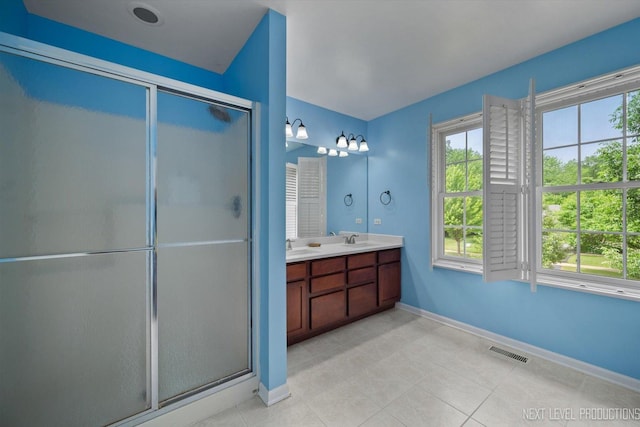 529 Hammer Ln, North Aurora, IL 60542 - full bathroom with a stall shower, double vanity, and tile patterned flooring