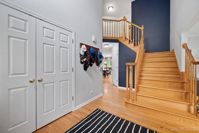 529 Hammer Ln, North Aurora, IL 60542 - foyer featuring wood finished floors, stairs, and a high ceiling