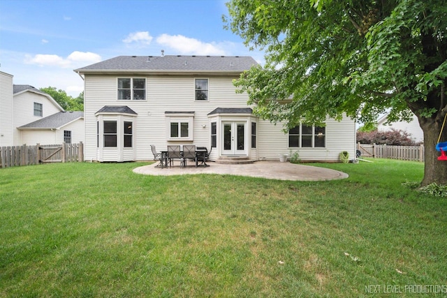 529 Hammer Ln, North Aurora, IL 60542 - back of property with french doors, a patio area, a fenced backyard, and a gate