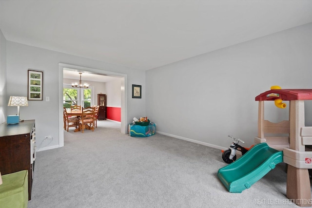 529 Hammer Ln, North Aurora, IL 60542 - rec room with a chandelier and carpet flooring