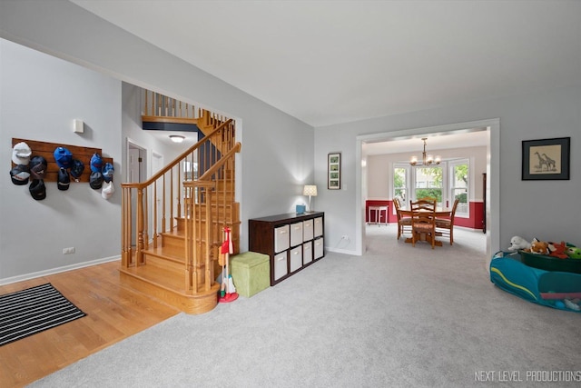 529 Hammer Ln, North Aurora, IL 60542 - stairs featuring a chandelier and carpet