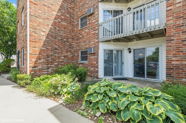 4301 W Shamrock Ln Unit 1C, Mchenry, IL 60050 - doorway to property with a balcony and brick siding