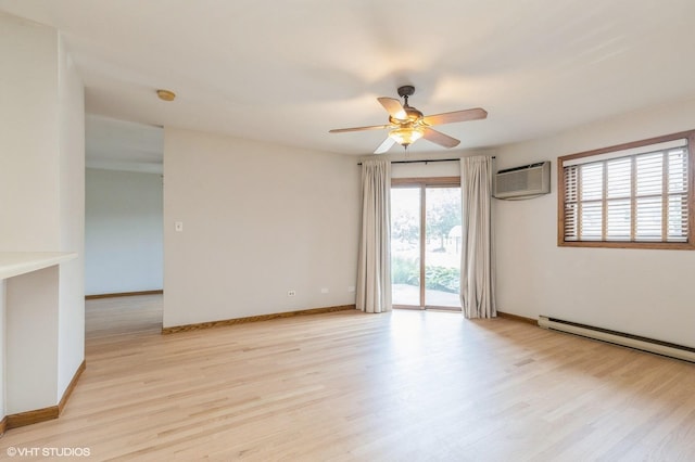 4301 W Shamrock Ln Unit 1C, Mchenry, IL 60050 - spare room featuring a wall unit AC, a baseboard radiator, light wood-type flooring, and ceiling fan