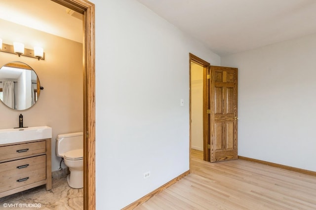 4301 W Shamrock Ln Unit 1C, Mchenry, IL 60050 - bathroom with vanity and wood finished floors