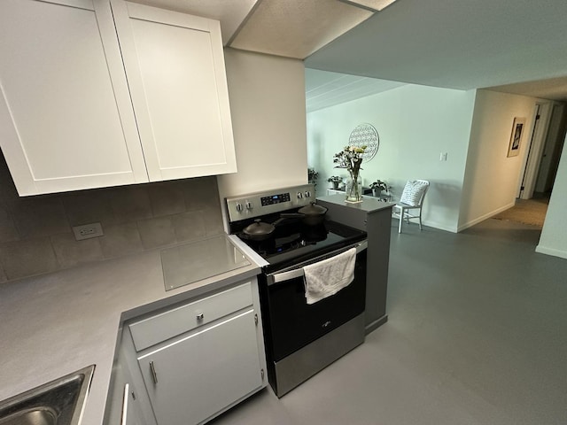 200 Deborah Ln Unit 13C, Wheeling, IL 60090 - kitchen with electric range, decorative backsplash, white cabinets, light countertops, and finished concrete floors