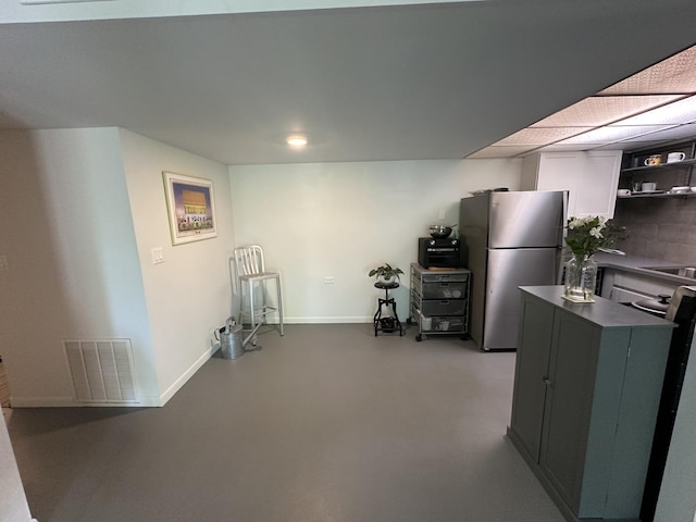 200 Deborah Ln Unit 13C, Wheeling, IL 60090 - interior space featuring freestanding refrigerator, open shelves, dark countertops, and backsplash