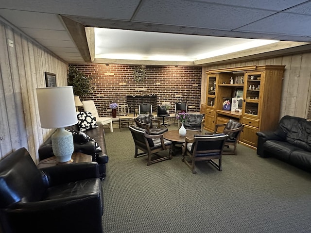 200 Deborah Ln Unit 13C, Wheeling, IL 60090 - dining area with carpet flooring, wood walls, brick wall, a fireplace, and a tray ceiling