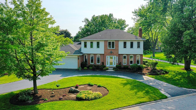 6316 Knollwood Ct, Lisle, IL 60532 - view of front of home with a chimney, brick siding, a front lawn, and curved driveway