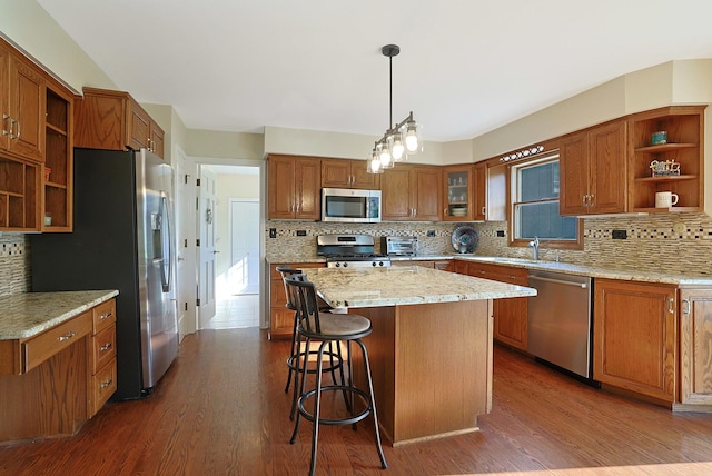 6316 Knollwood Ct, Lisle, IL 60532 - kitchen featuring appliances with stainless steel finishes, open shelves, brown cabinetry, a center island, and dark wood-style flooring