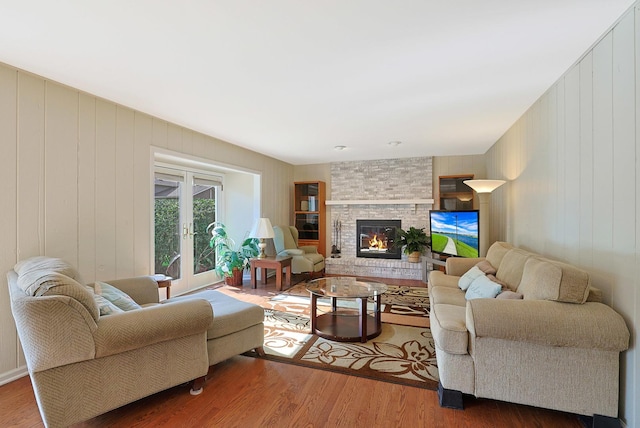 6316 Knollwood Ct, Lisle, IL 60532 - living room featuring french doors, wood finished floors, and a large fireplace