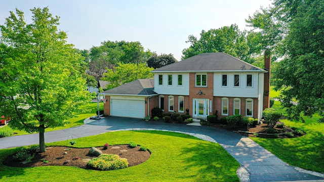 6316 Knollwood Ct, Lisle, IL 60532 - view of front of property featuring brick siding, a garage, a front lawn, curved driveway, and a chimney