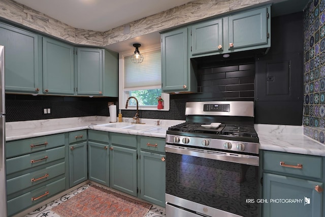 1601 Bolling Ave, Johnsburg, IL 60051 - kitchen featuring stainless steel gas range and decorative backsplash