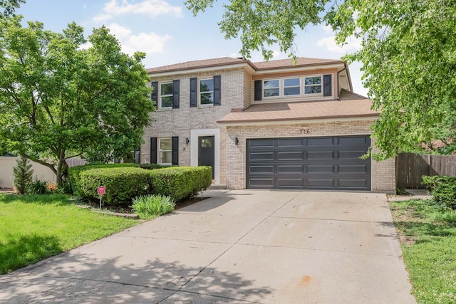 716 Somerset Ln, Darien, IL 60561 - view of front of property featuring concrete driveway, brick siding, and a garage