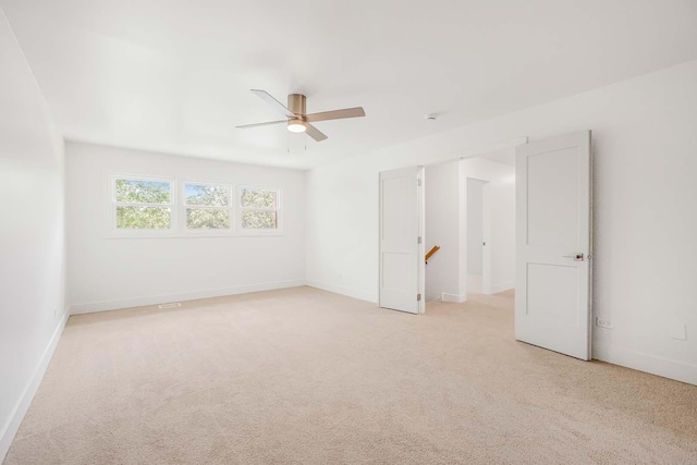 716 Somerset Ln, Darien, IL 60561 - unfurnished bedroom featuring light colored carpet and ceiling fan