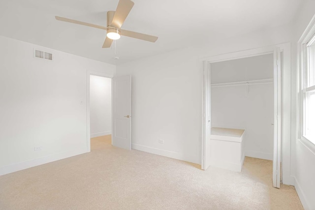 716 Somerset Ln, Darien, IL 60561 - unfurnished bedroom featuring a closet, light colored carpet, and ceiling fan