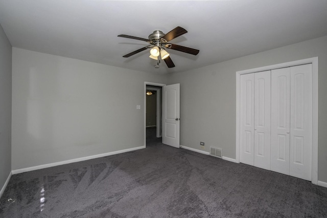 17801 Dogwood Ln, Hazel Crest, IL 60429 - unfurnished bedroom featuring dark colored carpet, a closet, and ceiling fan