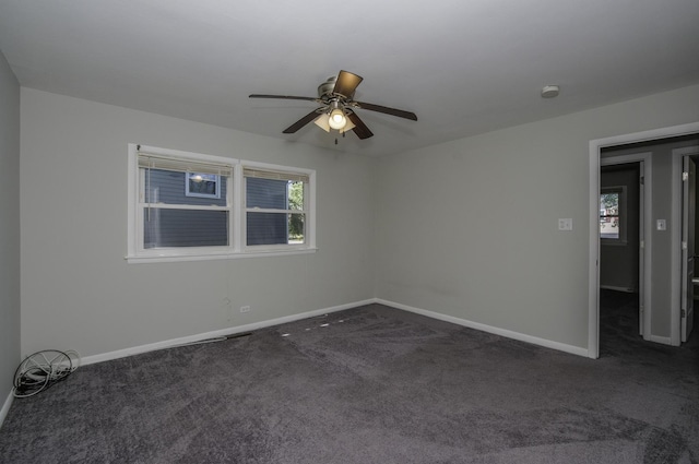 17801 Dogwood Ln, Hazel Crest, IL 60429 - empty room featuring dark colored carpet, ceiling fan, and a smoke detector