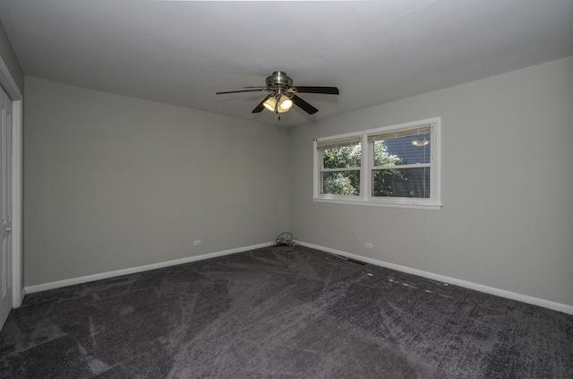 17801 Dogwood Ln, Hazel Crest, IL 60429 - spare room with dark carpet and ceiling fan