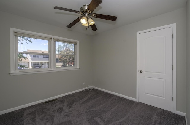 17801 Dogwood Ln, Hazel Crest, IL 60429 - spare room with dark carpet and ceiling fan