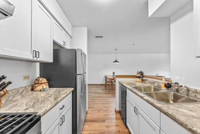 671 Hapsfield Ln Unit 105, Buffalo Grove, IL 60089 - kitchen with dishwasher, light wood-style flooring, light countertops, white cabinets, and freestanding refrigerator