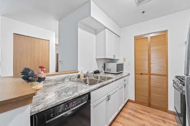 671 Hapsfield Ln Unit 105, Buffalo Grove, IL 60089 - kitchen featuring dishwasher, white microwave, light wood-style flooring, and white cabinets