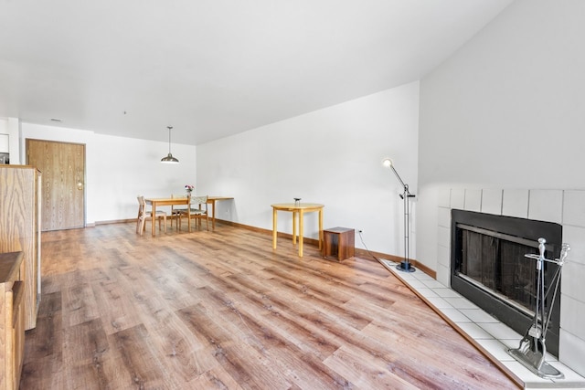 671 Hapsfield Ln Unit 105, Buffalo Grove, IL 60089 - living room featuring wood finished floors and a tiled fireplace