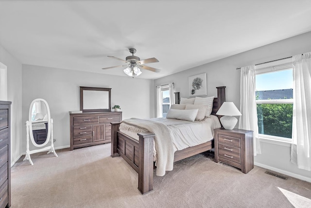 39371 Crofton Ln, Beach Park, IL 60083 - bedroom with light carpet, multiple windows, and a ceiling fan