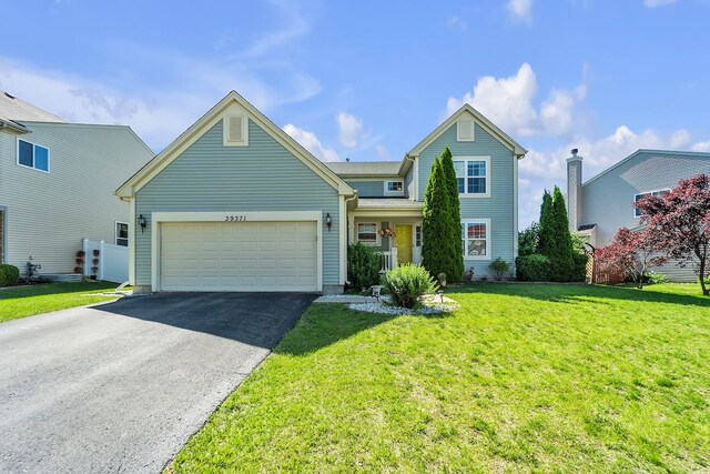 39371 Crofton Ln, Beach Park, IL 60083 - traditional home with driveway, a garage, and a front yard