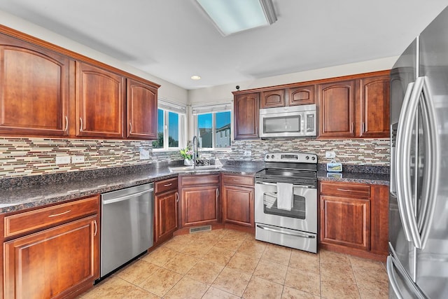 39371 Crofton Ln, Beach Park, IL 60083 - kitchen with stainless steel appliances, dark countertops, decorative backsplash, and recessed lighting