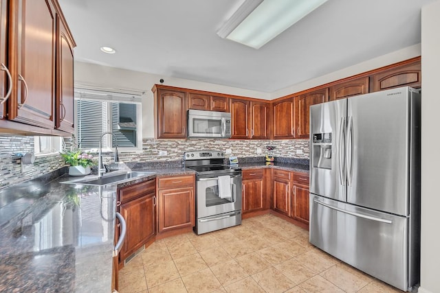 39371 Crofton Ln, Beach Park, IL 60083 - kitchen featuring stainless steel appliances, tasteful backsplash, light tile patterned floors, recessed lighting, and brown cabinetry