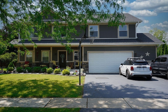281 Fox Chase Dr N, Oswego, IL 60543 - view of front of home featuring an attached garage, asphalt driveway, a front lawn, covered porch, and stone siding
