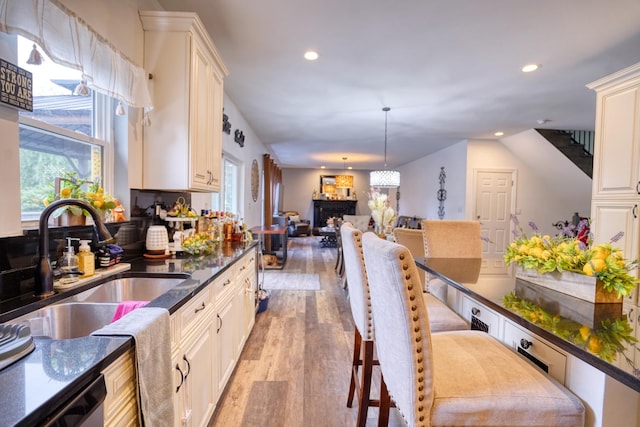 281 Fox Chase Dr N, Oswego, IL 60543 - kitchen featuring recessed lighting, light wood finished floors, healthy amount of natural light, dishwasher, and open floor plan