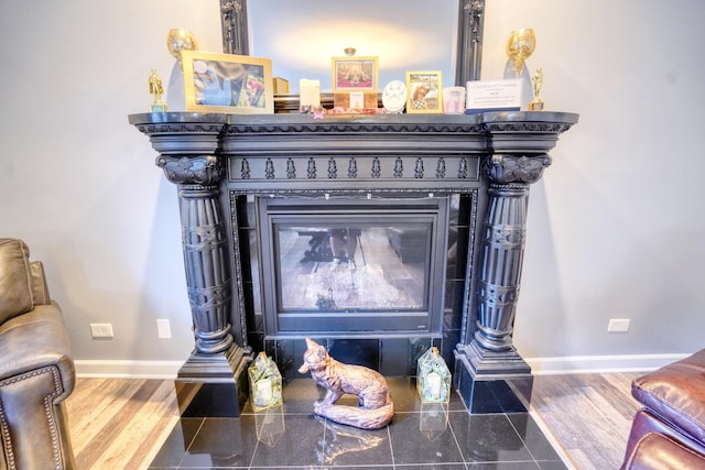 281 Fox Chase Dr N, Oswego, IL 60543 - detailed view of baseboards and a fireplace with flush hearth