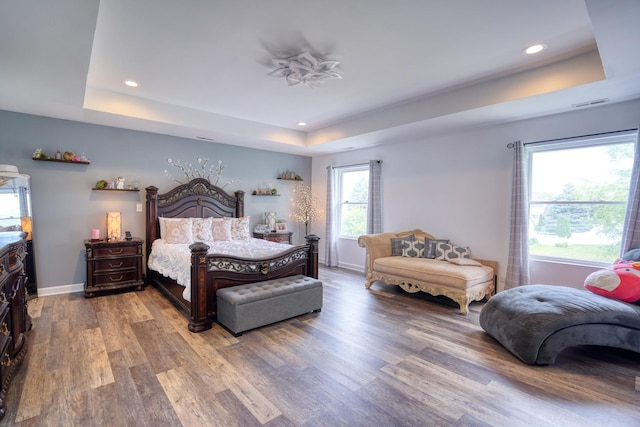 281 Fox Chase Dr N, Oswego, IL 60543 - bedroom featuring a tray ceiling, wood finished floors, and recessed lighting