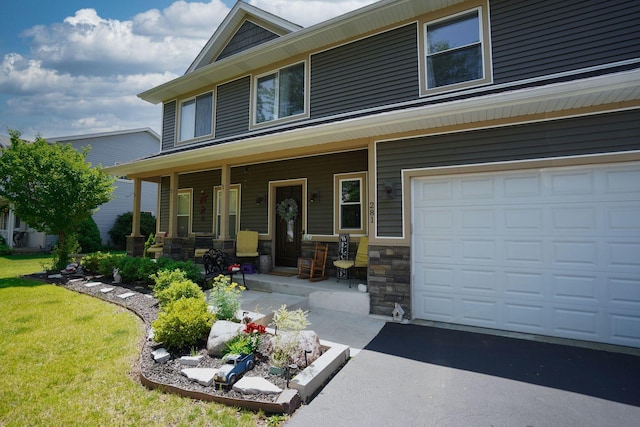 281 Fox Chase Dr N, Oswego, IL 60543 - view of front of home featuring covered porch, stone siding, a front lawn, and asphalt driveway