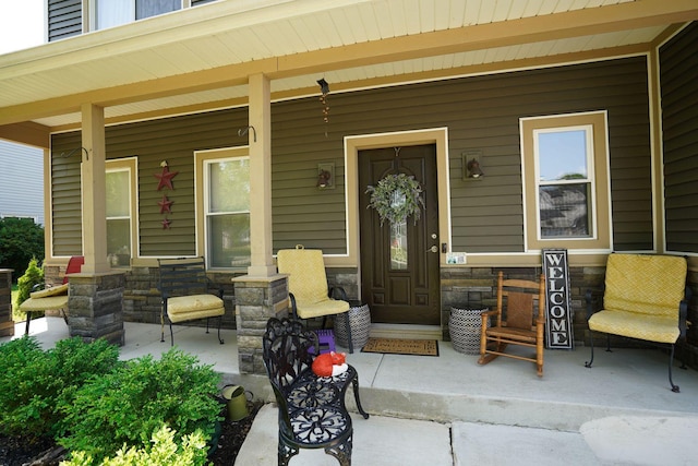 281 Fox Chase Dr N, Oswego, IL 60543 - property entrance with a porch and stone siding