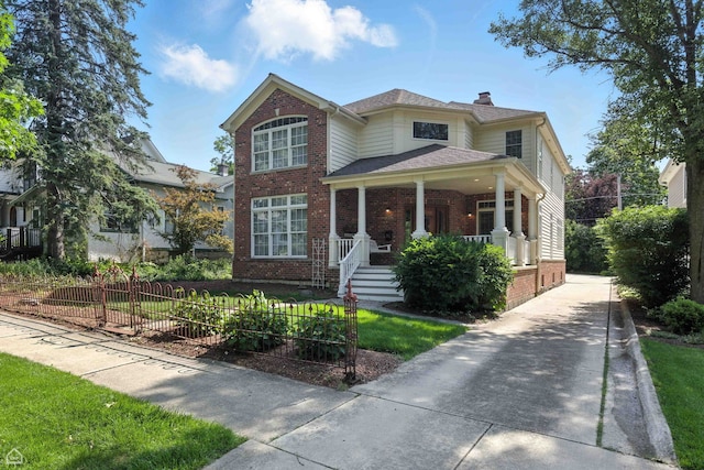 4829 Linscott Ave, Downers Grove, IL 60515 - traditional-style house featuring brick siding, covered porch, a chimney, and roof with shingles