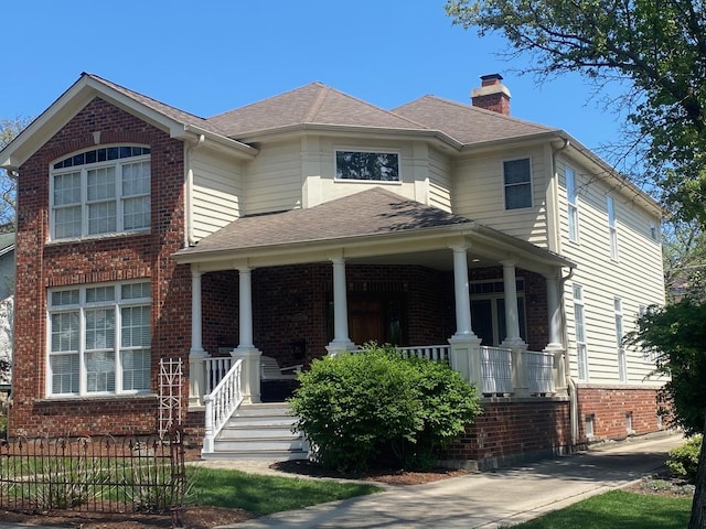 4829 Linscott Ave, Downers Grove, IL 60515 - view of front facade featuring a porch, a chimney, brick siding, and roof with shingles