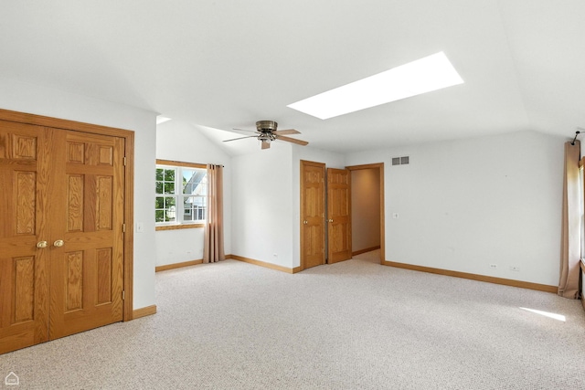 4829 Linscott Ave, Downers Grove, IL 60515 - spare room featuring a skylight, a ceiling fan, vaulted ceiling, and light carpet