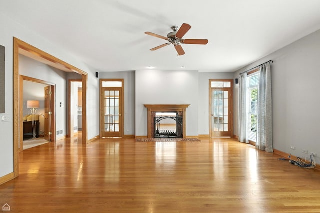 4829 Linscott Ave, Downers Grove, IL 60515 - unfurnished living room featuring light wood-style flooring, a fireplace, and ceiling fan