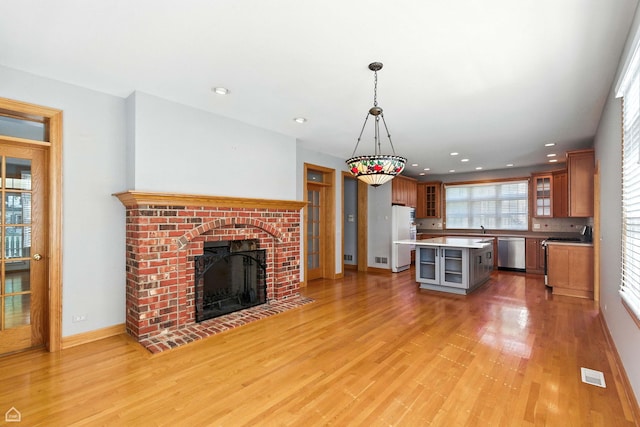 4829 Linscott Ave, Downers Grove, IL 60515 - kitchen with dishwasher, range with electric stovetop, a kitchen island, light wood-type flooring, and recessed lighting