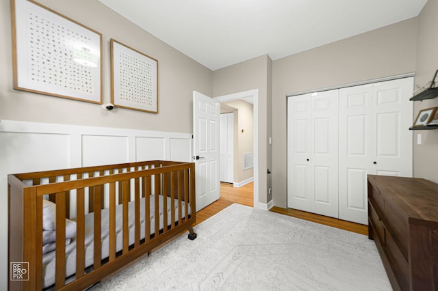 2636 N Fairfield Ave Unit 2N, Chicago, IL 60647 - bedroom with wood finished floors, a closet, and a crib