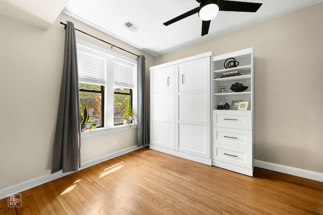 2636 N Fairfield Ave Unit 2N, Chicago, IL 60647 - unfurnished bedroom featuring light wood-style floors, a closet, and a ceiling fan