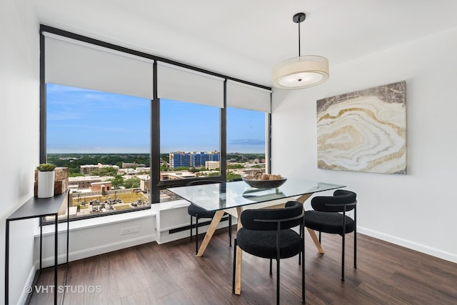 5445 N Sheridan Rd Unit 1515, Chicago, IL 60640 - dining space featuring dark wood finished floors, a view of city, and a wall of windows