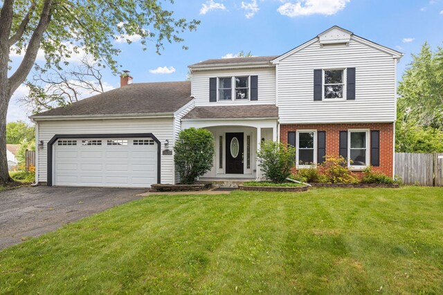 413 Northampton Ct, Naperville, IL 60565 - view of front facade with asphalt driveway, an attached garage, brick siding, and a chimney