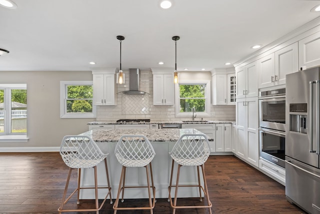 413 Northampton Ct, Naperville, IL 60565 - kitchen with wall chimney range hood, appliances with stainless steel finishes, plenty of natural light, white cabinetry, and recessed lighting