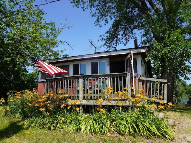 7084 N River Rd, Byron, IL 61010 - rear view of property featuring a wooden deck