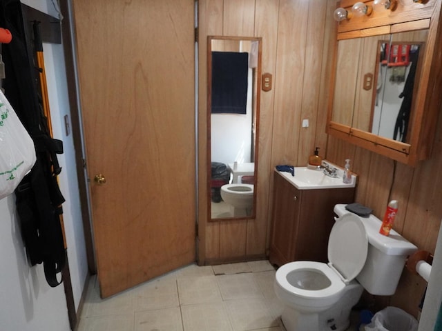 7084 N River Rd, Byron, IL 61010 - bathroom with vanity, wooden walls, and tile patterned floors
